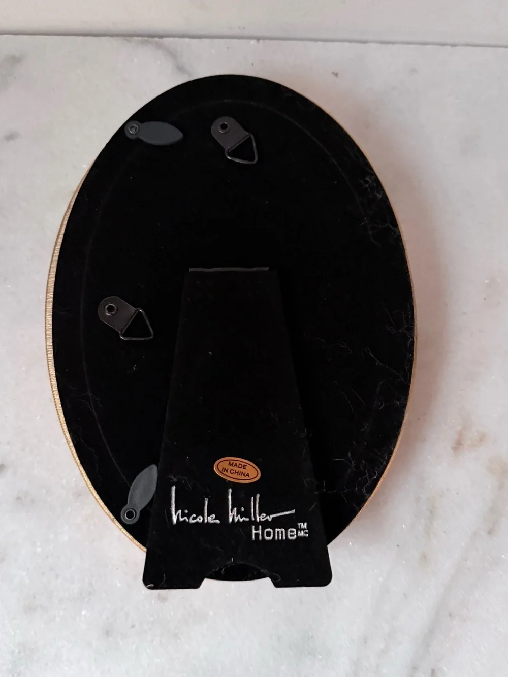 Nicole Miller stylish oval